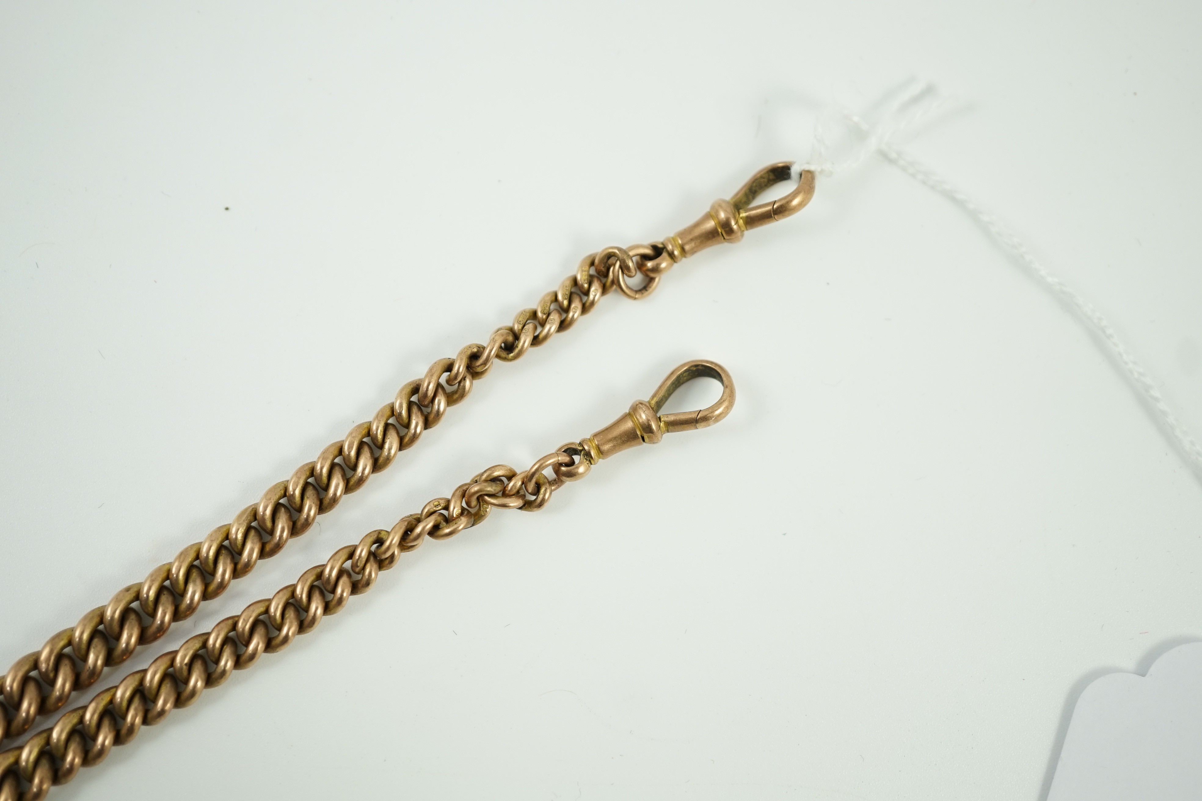 An early 20th century graduated 9ct gold curb link albert, 36cm, 39.7 grams.